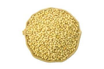 Dried soy beans in burlap sack isolated on white background top view flat lay stack, legumes in burlap sack 