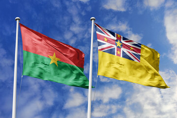 A Burkina Faso and Niue flag, a metaphor for Pacific-African ties, wave together against a blue...