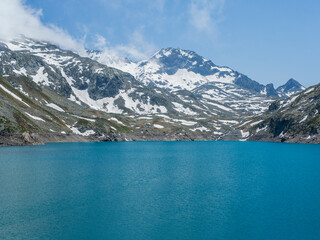 Turquoise Alpine Lake and Snowy Peaks – Lac des 7 Laux, French Alps