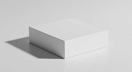 Minimalist White Box with Dramatic Shadow on a Clean, Bright Surface