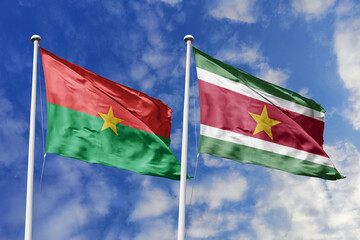 A Burkina Faso and Suriname flag, a metaphor for South American-African ties, wave together against...