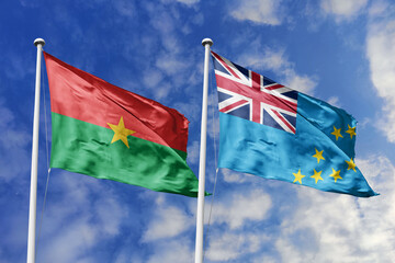 A Burkina Faso and Tuvalu flag, a metaphor for Pacific-African bonds, wave together against a blue sky, symbolizing friendship and cultural exchange.