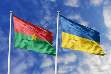 A Burkina Faso and Ukraine flag, a metaphor for global solidarity, wave together against a blue sky, symbolizing friendship and mutual support.