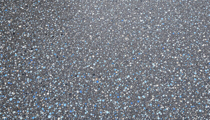 Black and blue terrazzo stones on concrete floor