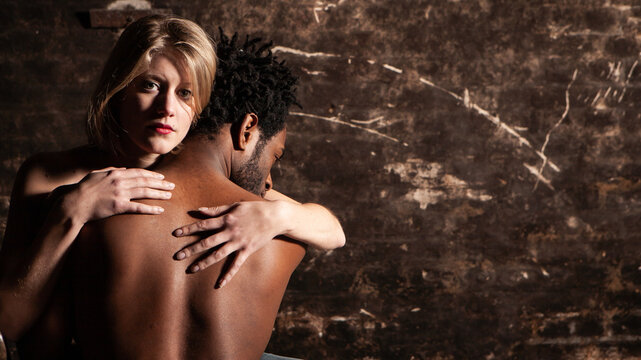 Mixed Emotions. Eye contact and a stoic expression from a woman in flagrant. From a series of images with the same models.