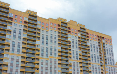 Construction of new high-rise buildings against a bright sky