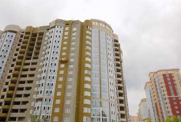 Construction of new high-rise buildings against a bright sky