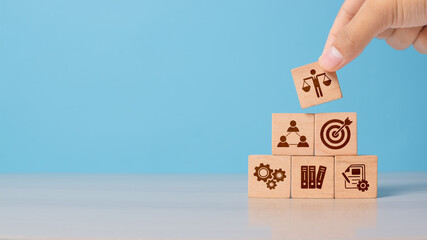 Hand shows wooden block with business ethics icon. Concept of trust, transparency, and moral...