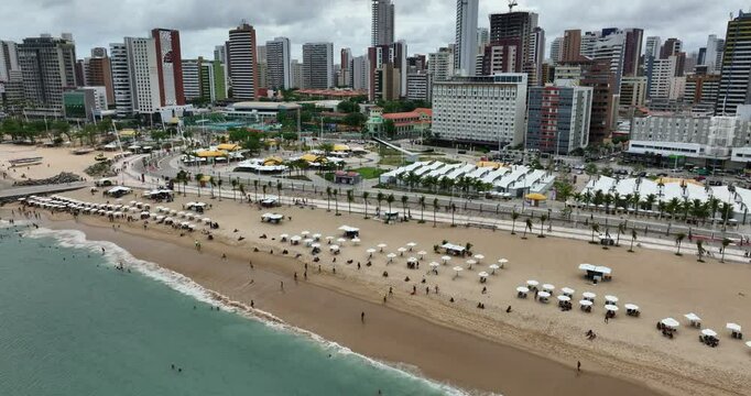 People At The Mansa Beach With Beachside Market And Hotels In Fortaleza, Brazil. - aerial shot
