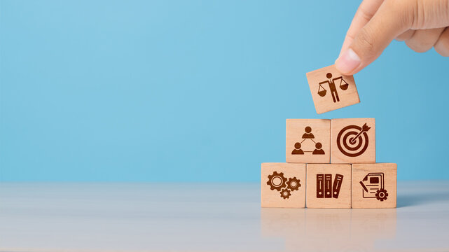 Hand shows wooden block with business ethics icon. Concept of trust, transparency, and moral responsibility