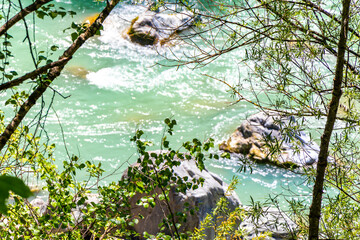 River steam Inn with rocks nature between mountains in Tyrol Austria.