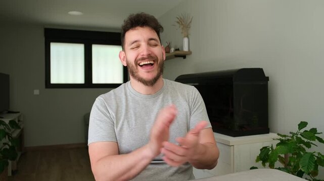 Young man sitting and faking laughter in different ways