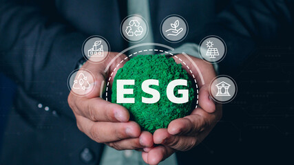 Hand of human holding green earth ESG icon for Environment Social and Governance, World sustainable environment concept.
