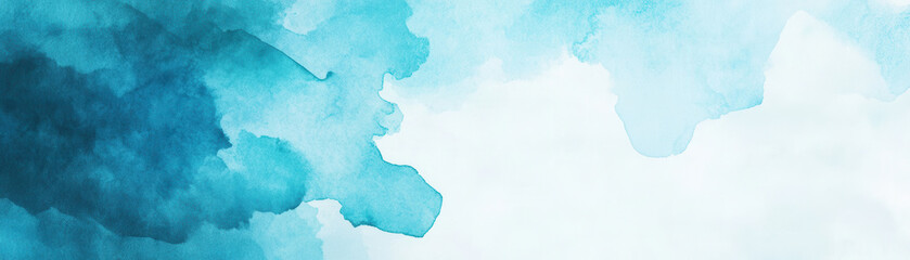 Splash of blue and white watercolor paint on paper creating soft and calming abstract background with fluid texture