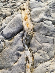broken stone texture. unusual stone. slate inclusions. slate veins in stone