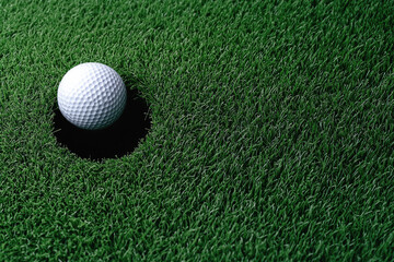 Golf ball green grass hole closeup sport outdoor competition success falling excitement