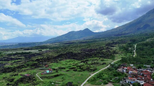 West Java, Indonesia - April 8, 2025: Aerial view drone shot of Mount Guntur and village in Garut