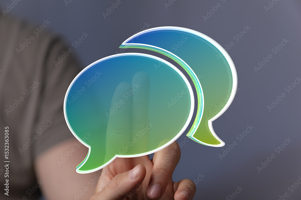 Aufkleber Abstract image of two speech bubbles on a finger, symbolizing online communication and conversation.