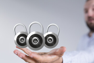 Image of three padlocks in a hand, representing data security and online protection.