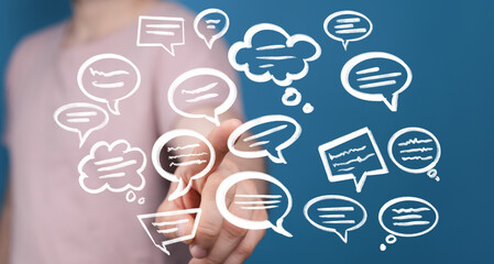 Person interacting with floating speech bubbles, representing communication, ideas, and social media.