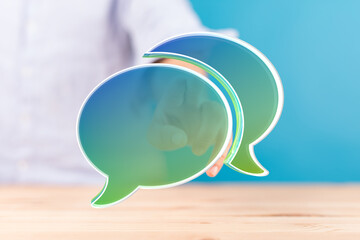 Abstract image of speech bubbles and a hand, ideal for communication or feedback concepts.