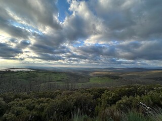 A landscape with trees and clouds