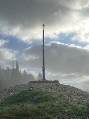 A tall cross on a hill