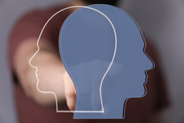 Stock photo depicting two head outlines, symbolizing diverse viewpoints and collaboration.