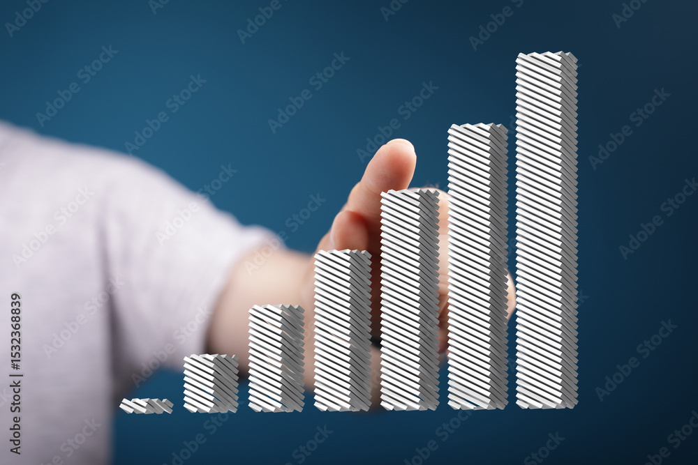 Aufkleber hand interacting with a 3d bar chart illustrating upward growth and success.