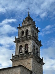 A tall tower with a cross on top