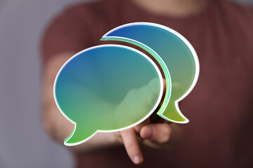 Abstract image of person interacting with digital speech bubbles,communication, conversation,...