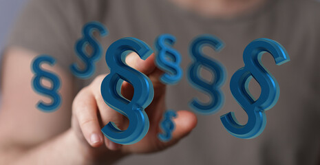Abstract image of a hand interacting with blue paragraph symbols.  Perfect for legal, law, and...