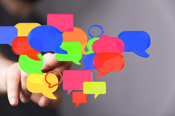 Abstract image of colorful speech bubbles, representing communication, social media, and online...