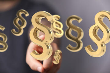3D rendering of golden paragraph symbols, ideal for legal, law, and justice concepts.