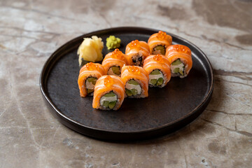 A beautifully arranged platter of sushi rolls showcases vibrant colors and fresh ingredients,...