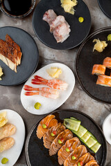 A delightful spread of sushi and sashimi showcases vibrant colors and fresh ingredients, enticing diners to indulge in a serene culinary experience during a sunny afternoon