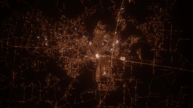 Monroe (Louisiana, USA) aerial view at night. Top view on modern city with street lights. Camera is zooming out, rotating clockwise