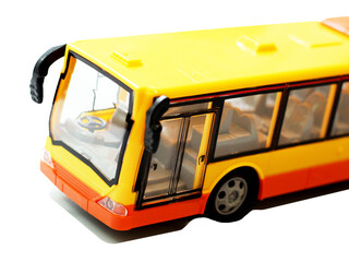 Toy yellow accordion bus on a white background.