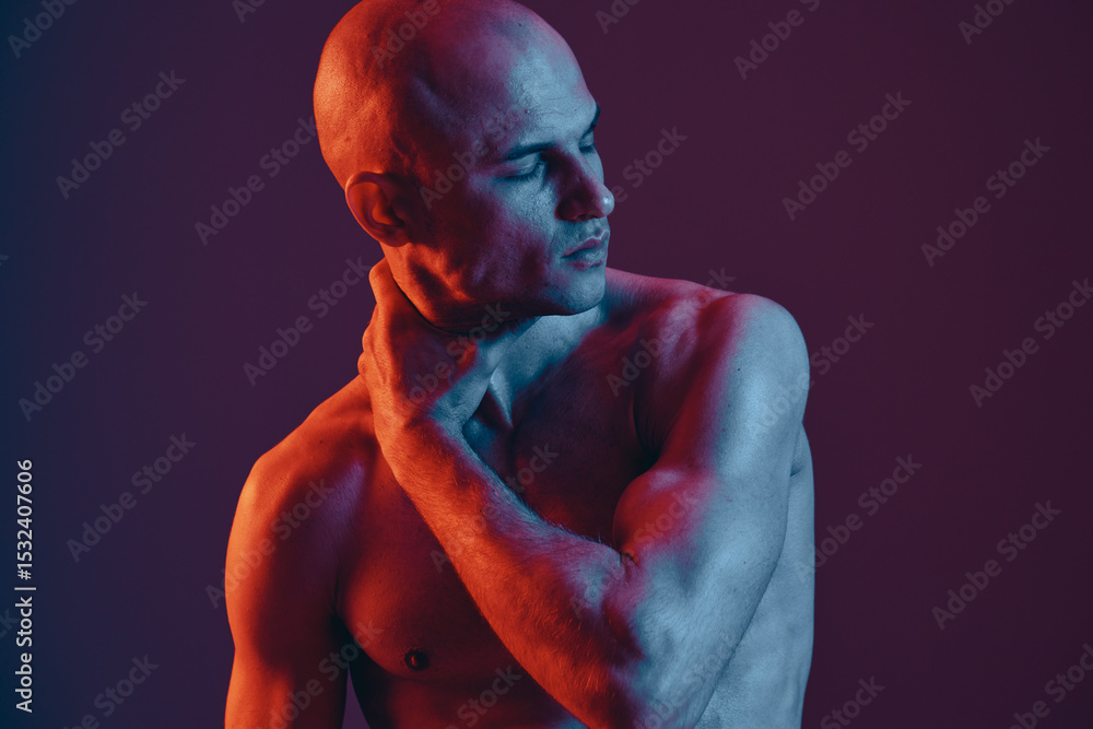 Poster a striking image of a man with a contemplative expression, showcasing a unique blend of light and sh