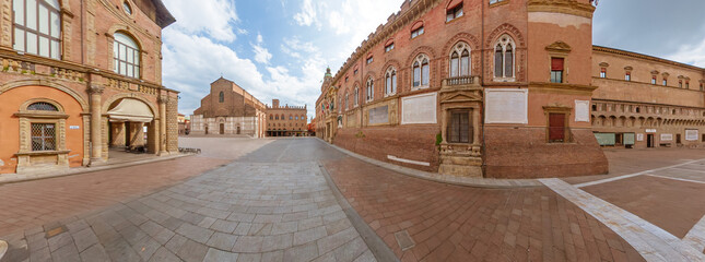 Bologna city panorama of Maggiore square with Palazzo Accursio Municipal Palace and San Petronio Basilica. In Bologna, Italy, during spring day without people