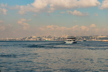 Ferry and Sultanahmet disctrict in Istanbul seen over Bosporus strait, Turkey