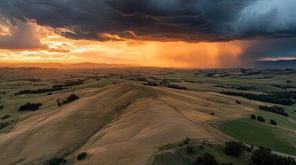 Dramatic Sunset Over Rolling Hills with Dark Clouds and Rainshowers, Capturing Nature's Beauty and Landscape Serenity in a Picturesque Setting
