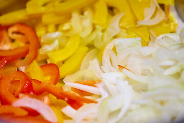 Mixed chopped vegetables for cooking, onion, yellow and red bell pepper, carrot