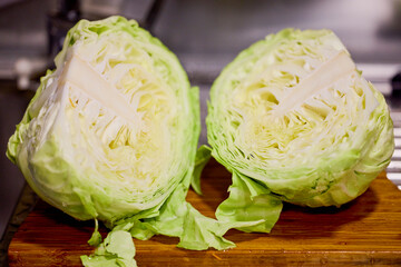 fresh white cabbage cut in half with water droplets on it