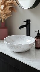 Compact Round Marble Pedestal Basin with Matte Black Fixtures in Contemporary Powder Room. Perfect for contemporary interior and bathroom design themes.