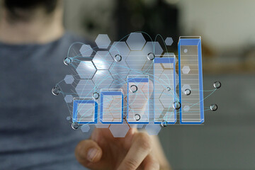 Person interacts with a digital chart showing business growth and data analysis.  Modern technology...