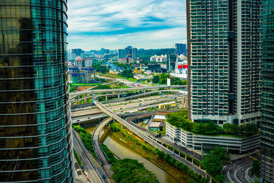 KL traffic junction as seen between tall sky scrapers