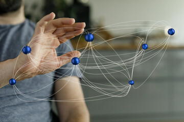 A hand interacts with a digital network, illustrating global connectivity and data interaction.