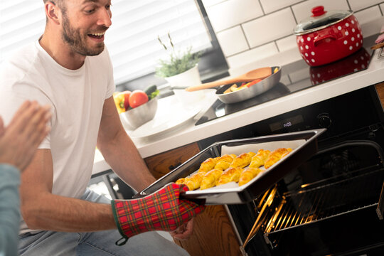 Happy man with freshly baked and homemade croissants