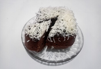 A piece of cake brownies brown with a sprinkling of cheese delicious